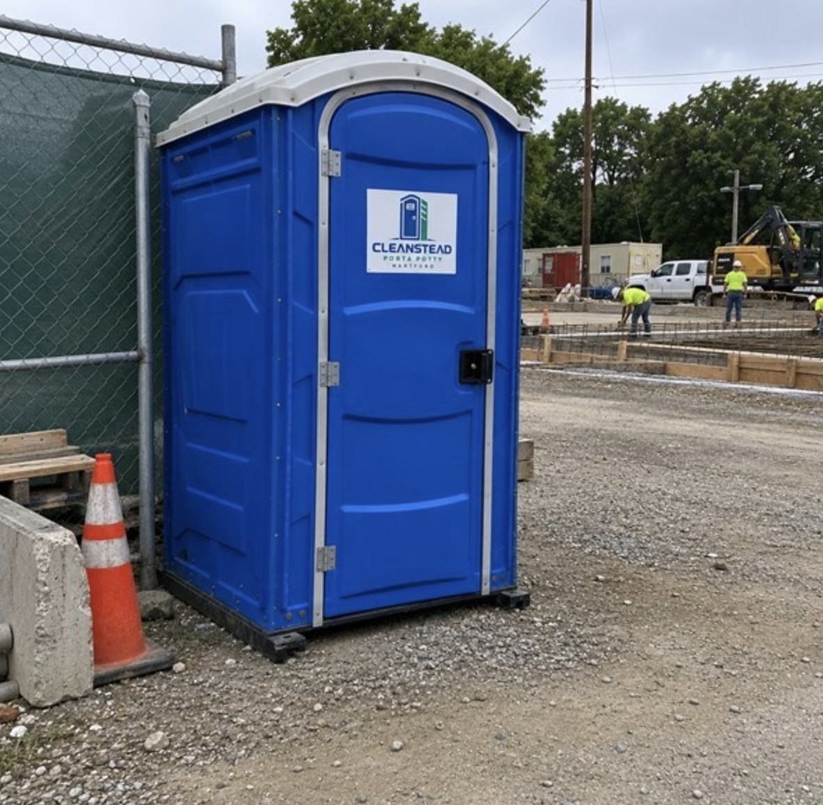 Blue porta potty at construction site in Hartford